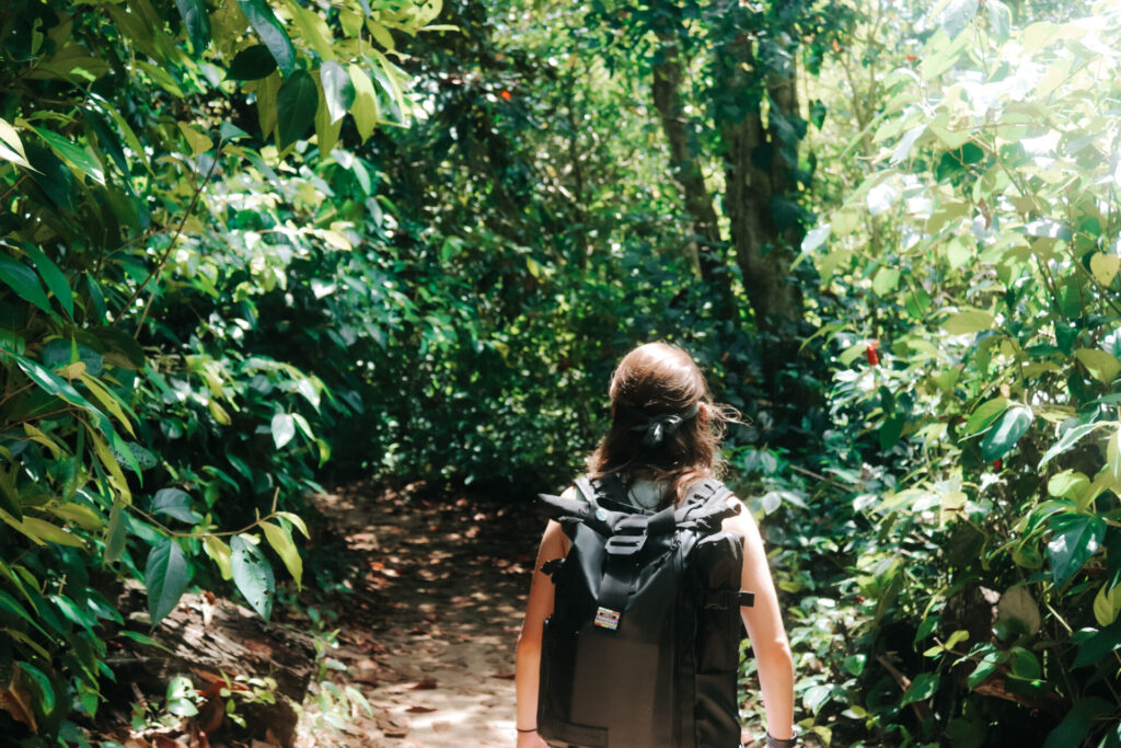 Wini hiking through lush forest in Cahuita National Park, Costa Rica
