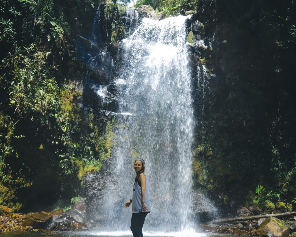 Wini on a waterfall on the Lost Waterfalls Trail in Boquete, Panama