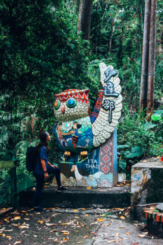 Wini by owl statue in Sun Moon Lake, Taiwan