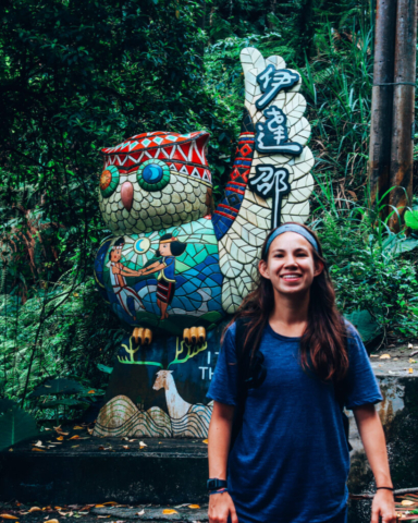 Wini by owl statue in Sun Moon Lake, Taiwan