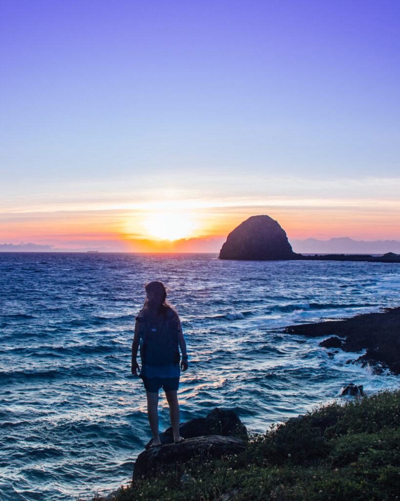 Wini by the ocean at sunset on Lanyu Island, Orchid Island, Taiwan