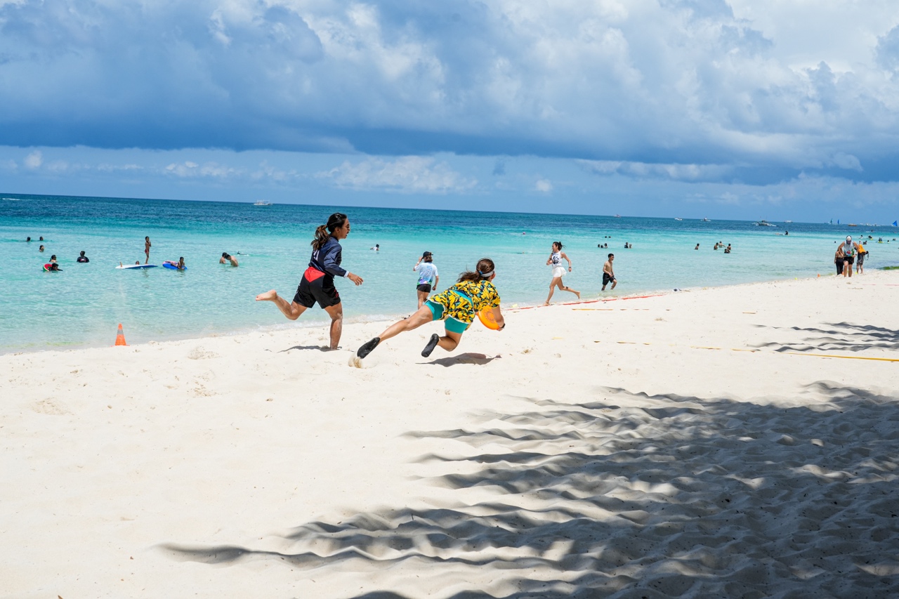 Diving for disc, Ultimate frisbee beach tournament. Boracay, Philippines