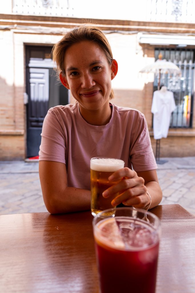 Wini drinking a spanish cerveza beer in Seville, Spain