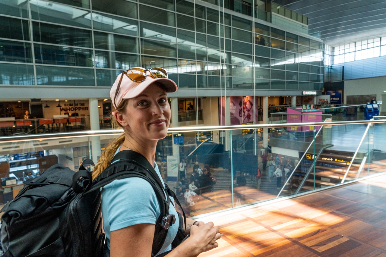 Backpacker woman in Copenhagen Airport