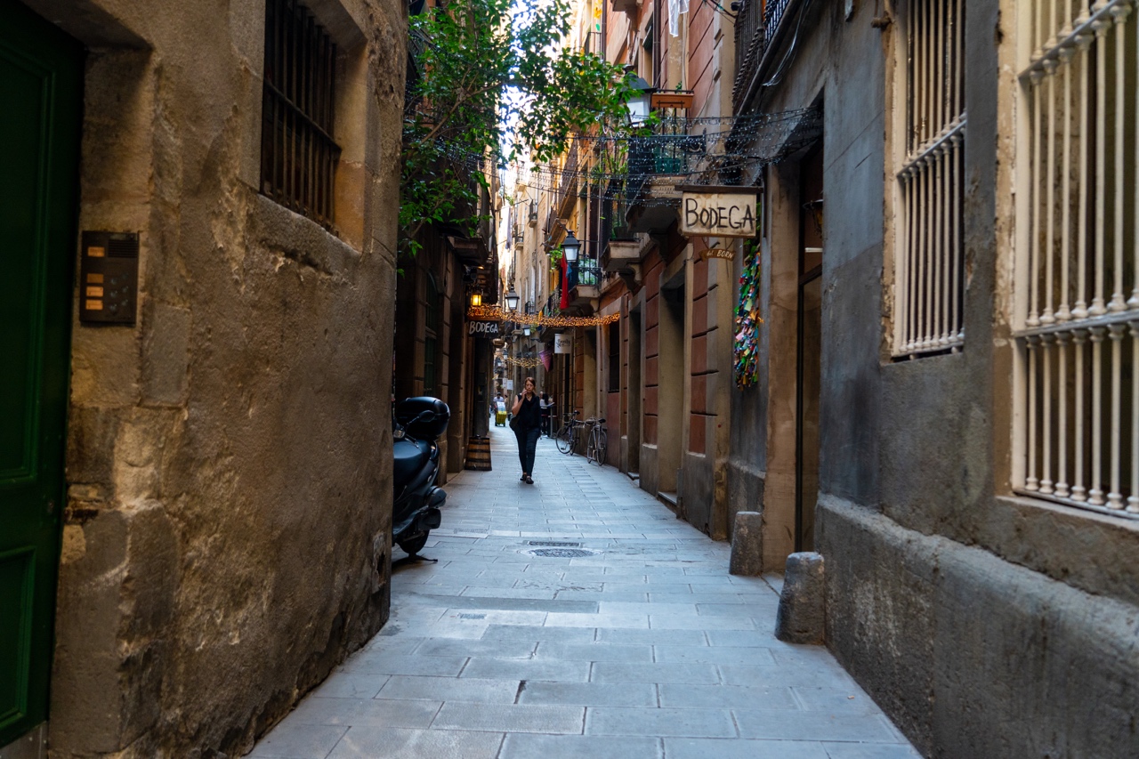 Cute alleyway in El Born Neighborhood of Barcelona, Spain with a Bodega sign