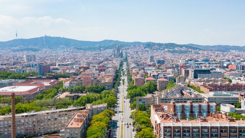 Barcelona drone shot from the Barcelona Beach that views the Sagrada Familia. Sights to see in Barcelona on a budget.