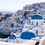 Santorini Fira to Oia hike, classic greek village, blue dome church roofs, aegean sea